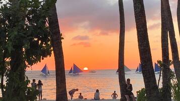 On the beach, white sand, beach towels