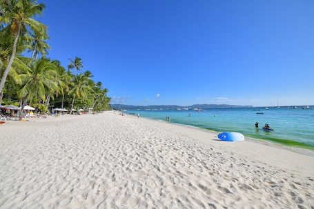 On the beach, white sand, beach towels