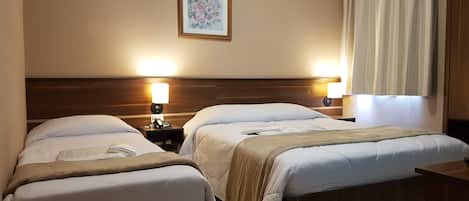 Triple Room, Multiple Beds, City View | Minibar, desk, laptop workspace, blackout drapes