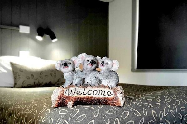 Premium bedding, desk, laptop workspace, soundproofing