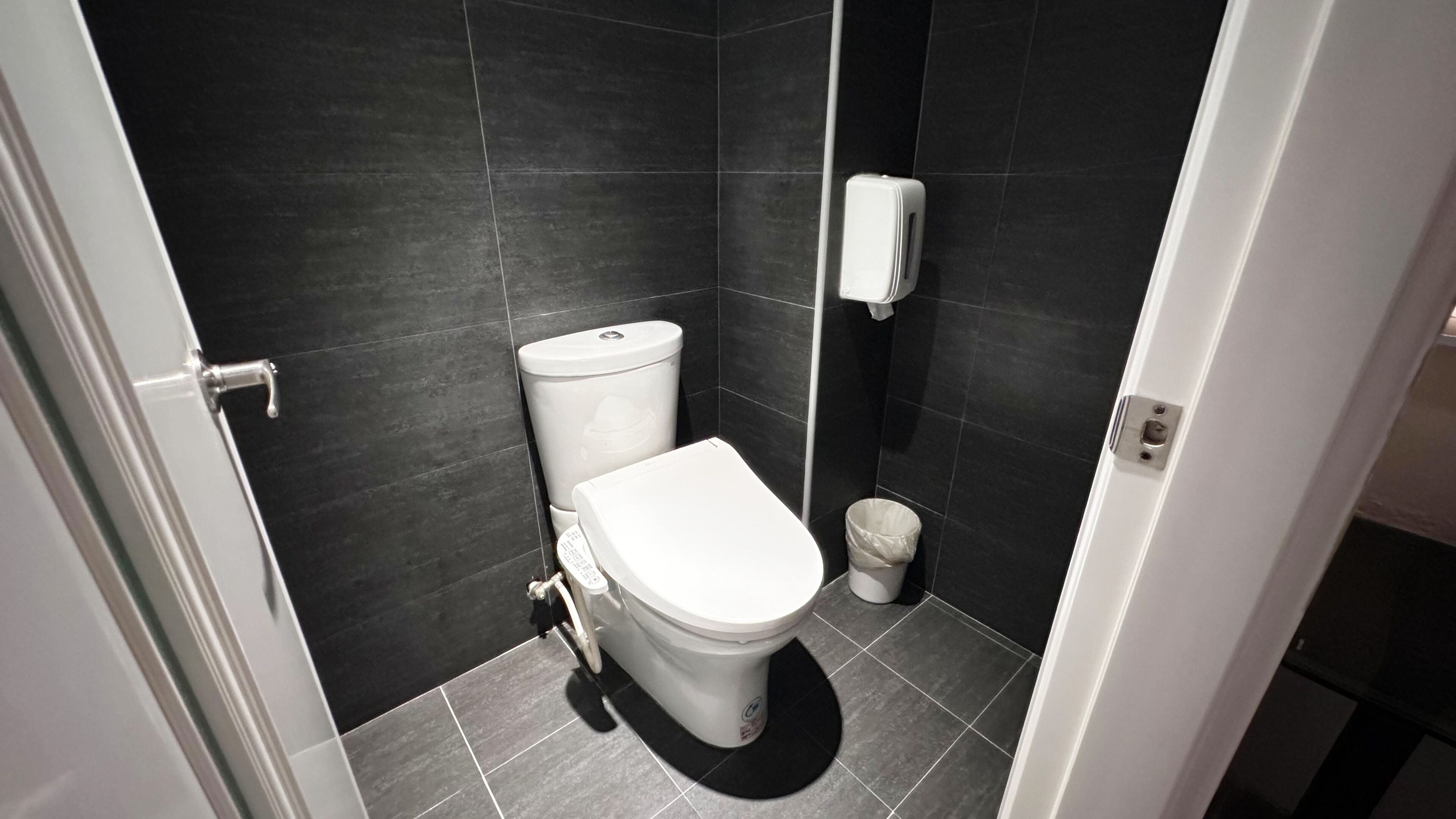 room | bathroom | rainfall showerhead, hair dryer, slippers, towels