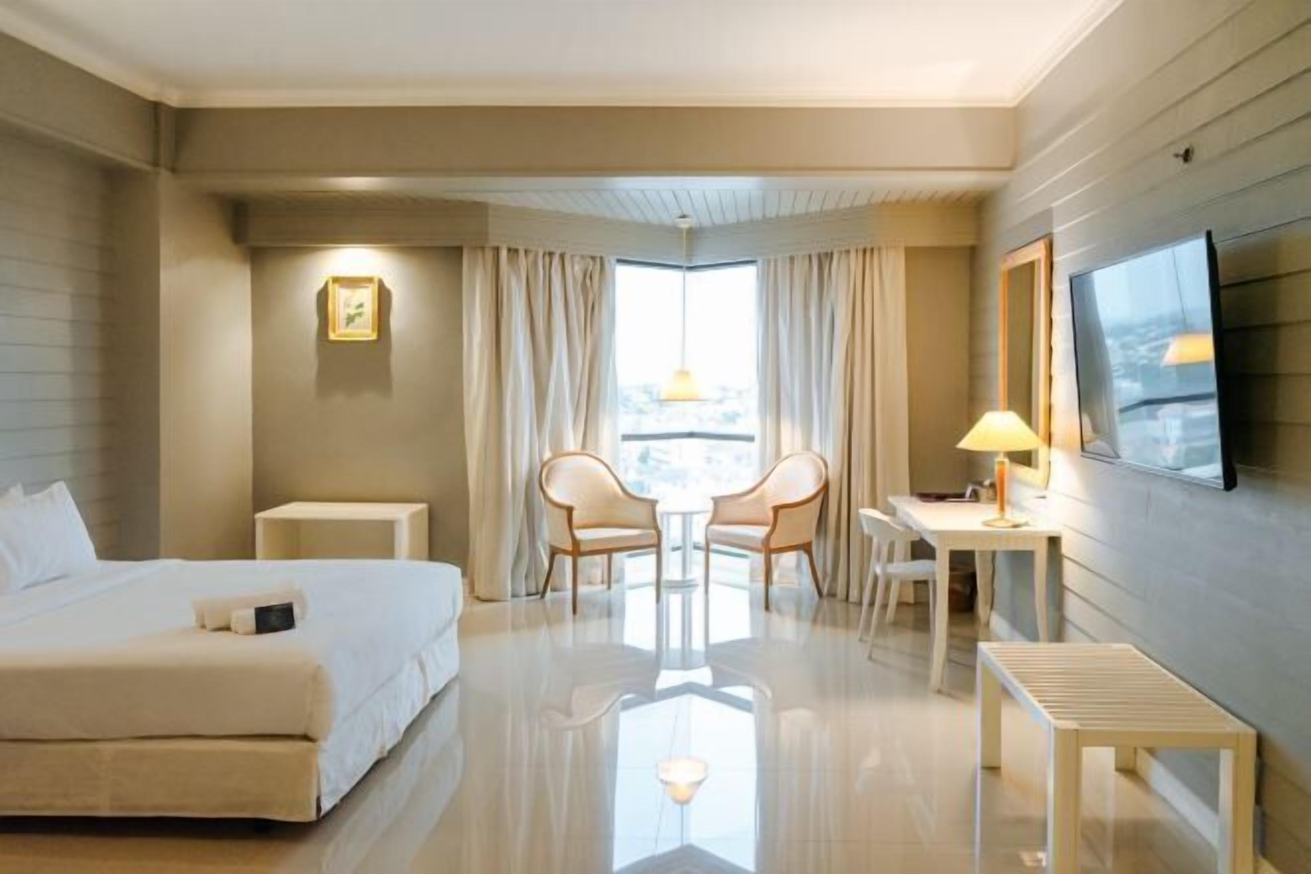 Desk, laptop workspace, blackout curtains, free WiFi