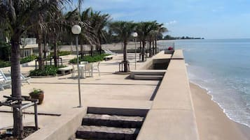 On the beach, sun-loungers