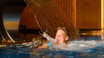Relax in a soothing hot tub with water gently cascading over the edge.