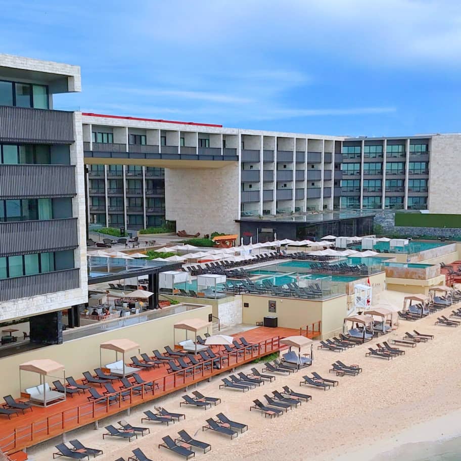 On the beach, white sand, beach umbrellas, beach towels