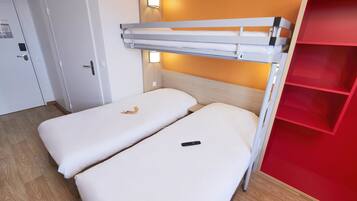 A bunk bed with a red storage unit beside it.