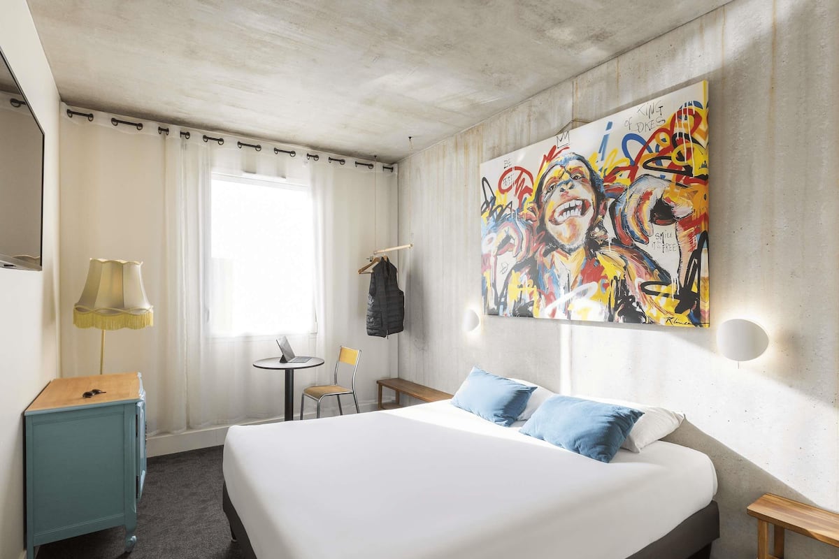 Premium bedding, desk, laptop workspace, blackout curtains