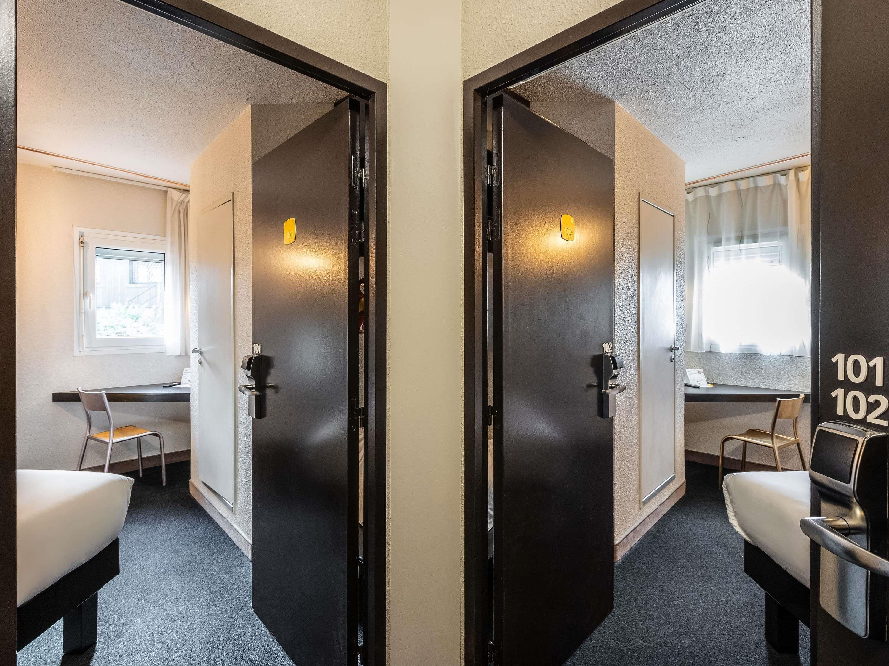 Premium bedding, desk, laptop workspace, blackout drapes