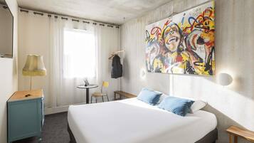 Premium bedding, desk, laptop workspace, blackout drapes