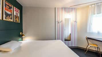 Premium bedding, desk, laptop workspace, blackout curtains