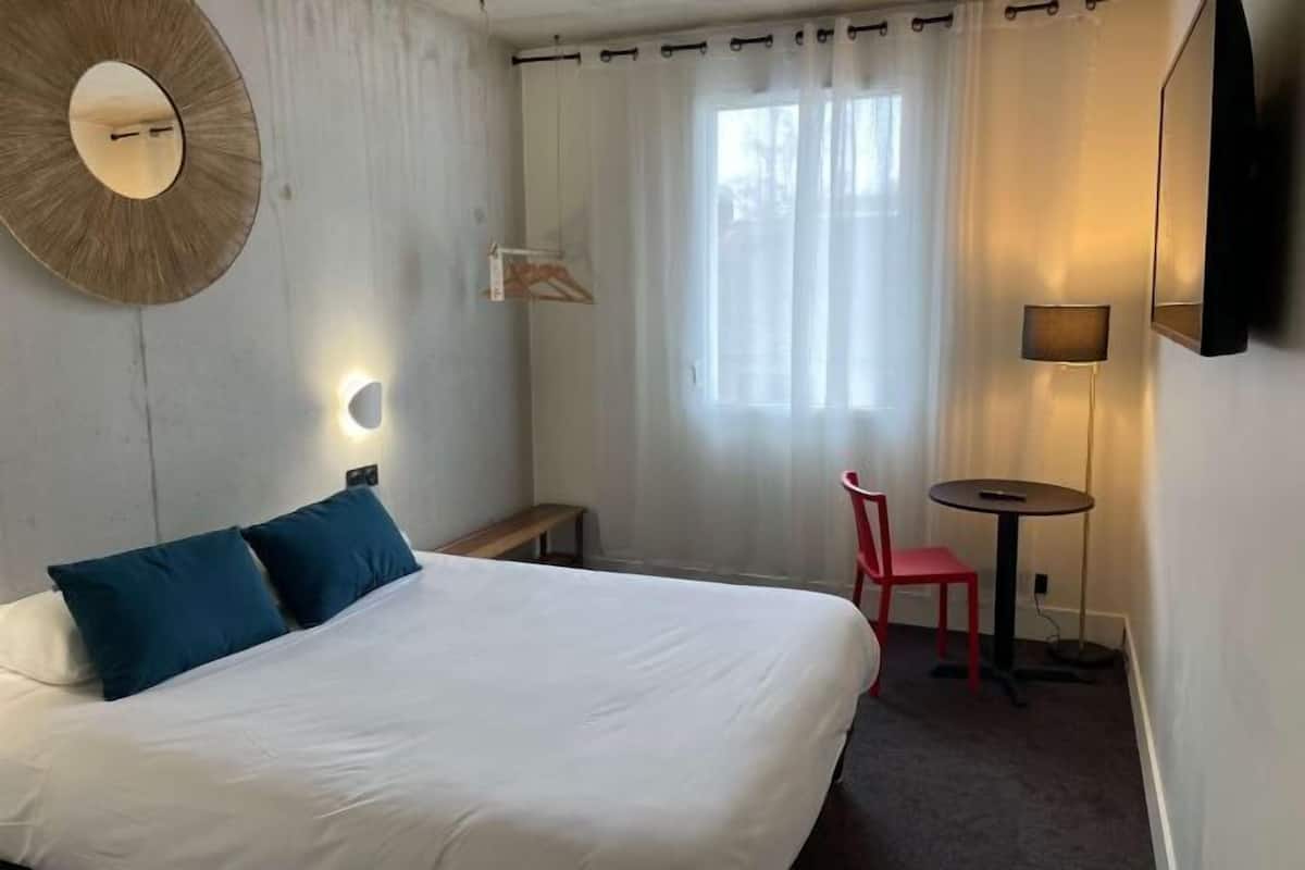 Premium bedding, desk, laptop workspace, blackout curtains