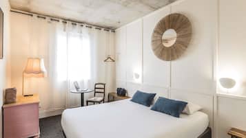 Premium bedding, desk, laptop workspace, blackout curtains