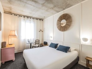 Premium bedding, desk, laptop workspace, blackout drapes