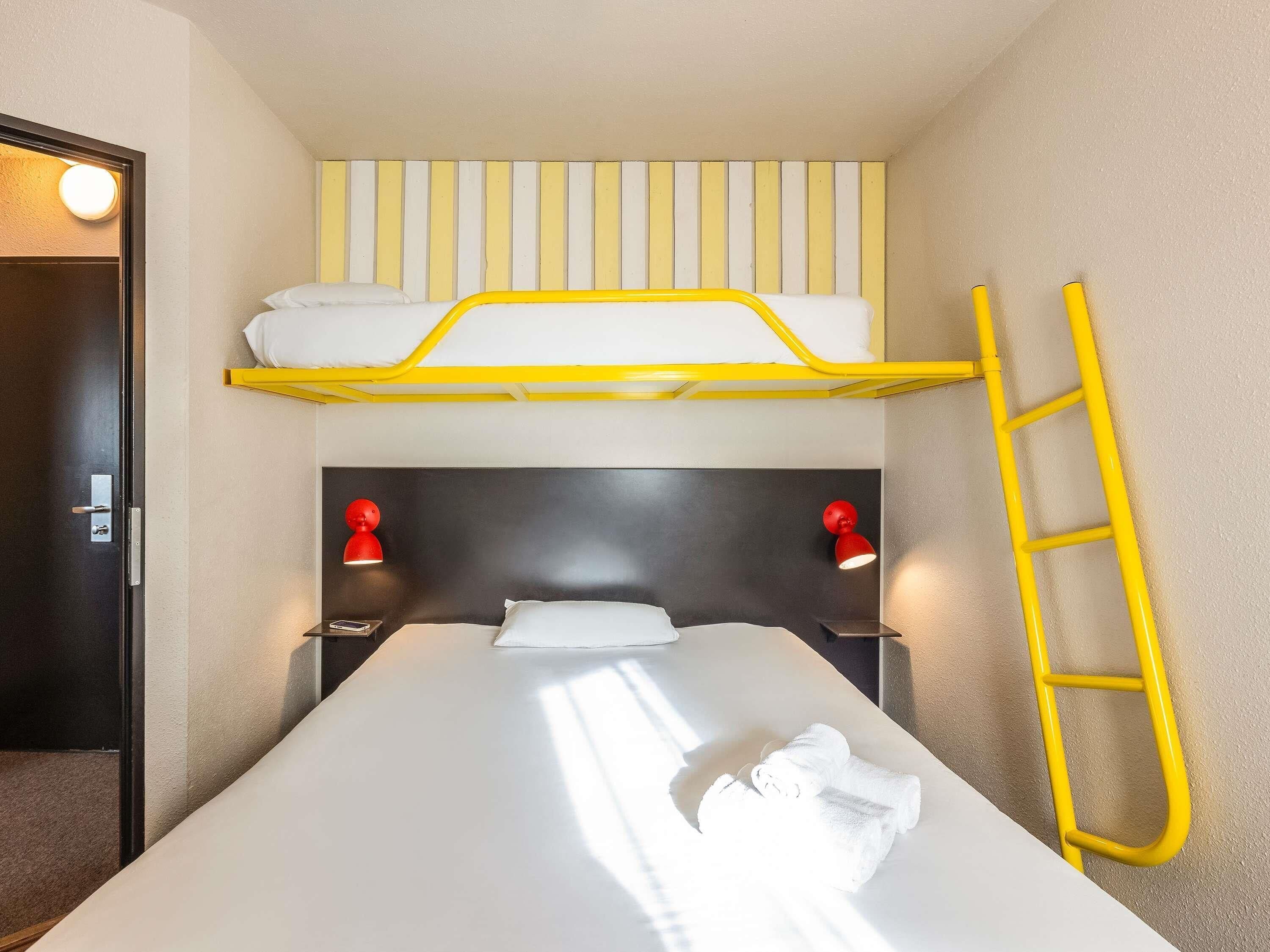 Premium bedding, desk, laptop workspace, blackout curtains