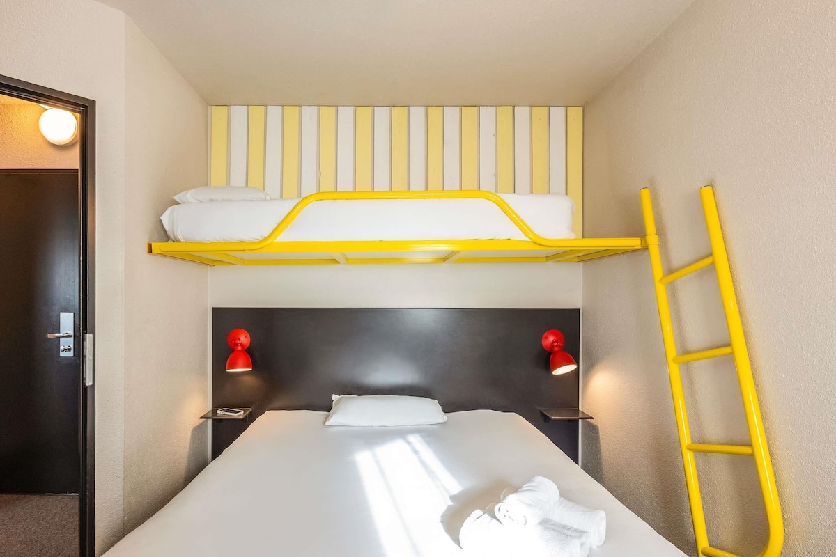 Premium bedding, desk, laptop workspace, blackout curtains