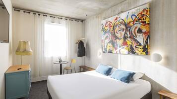 Premium bedding, desk, laptop workspace, blackout drapes