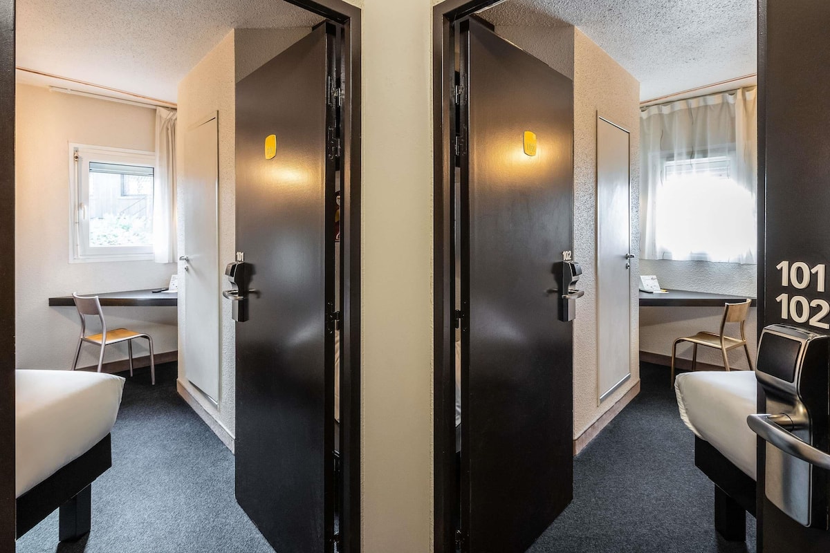 Premium bedding, desk, laptop workspace, blackout curtains