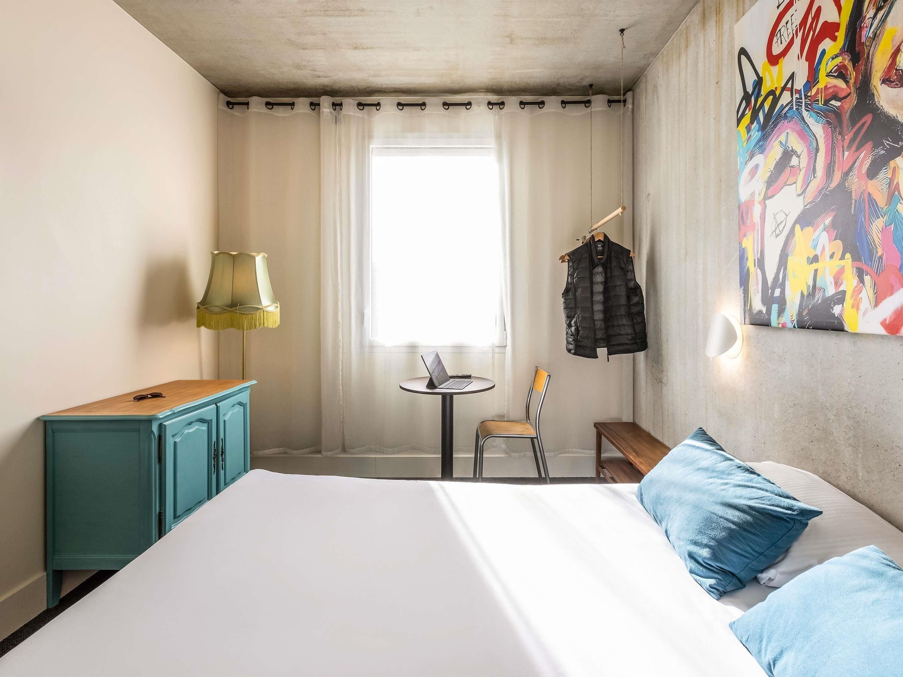 Premium bedding, desk, laptop workspace, blackout curtains