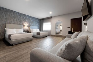 Grand Double Room, Multiple Beds | Minibar, in-room safe, individually furnished, desk