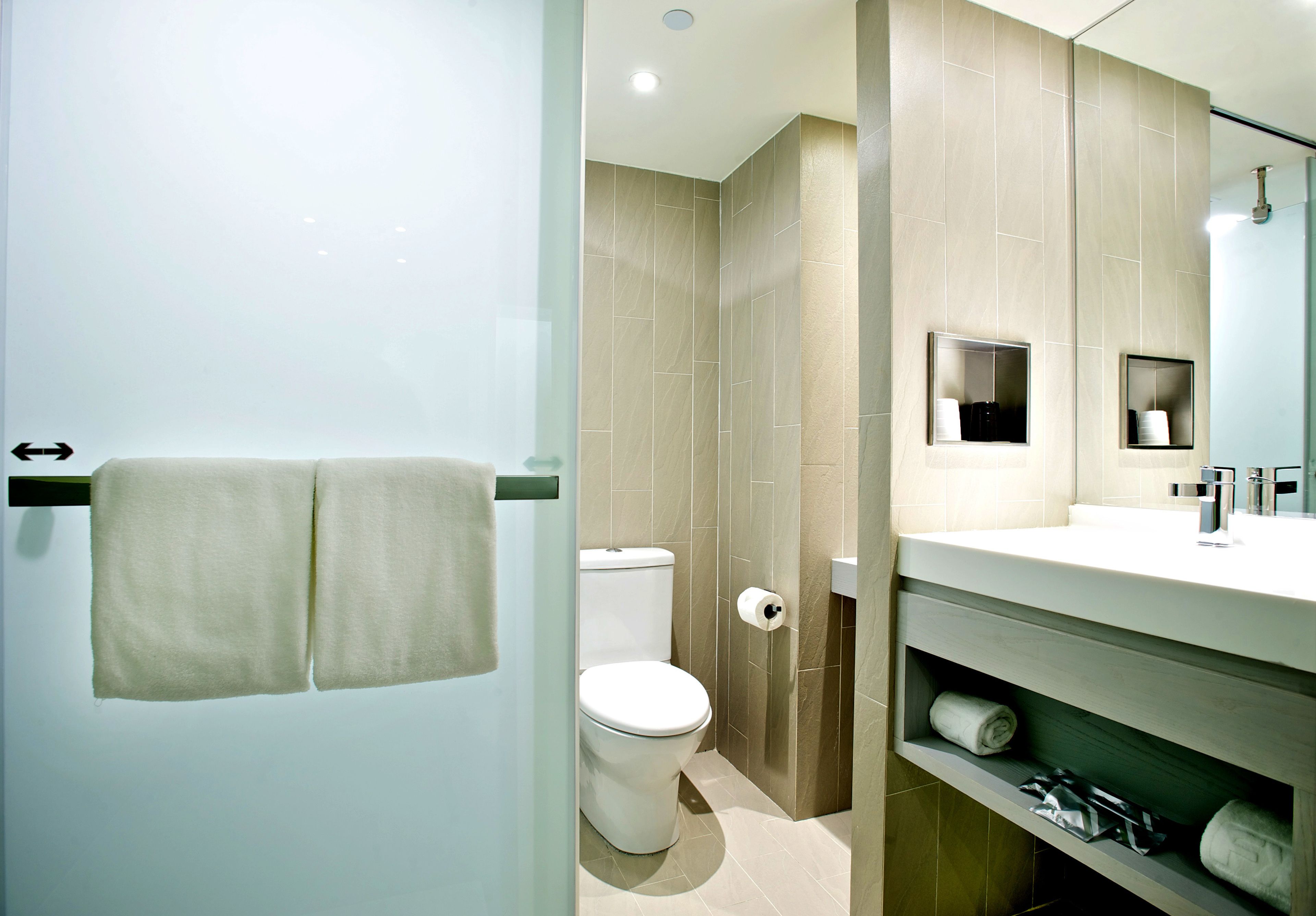 shower, hair dryer, slippers, towels