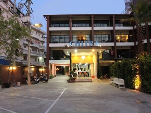A hotel entrance with a sign reading "CHITRA". - Chitra Suite (Pattaya)
