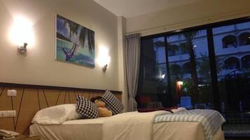 Deluxe Room, Pool Access | In-room safe, desk, blackout drapes, rollaway beds