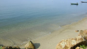 On the beach, sun-loungers