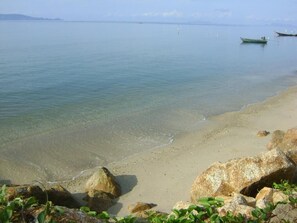 On the beach, sun loungers