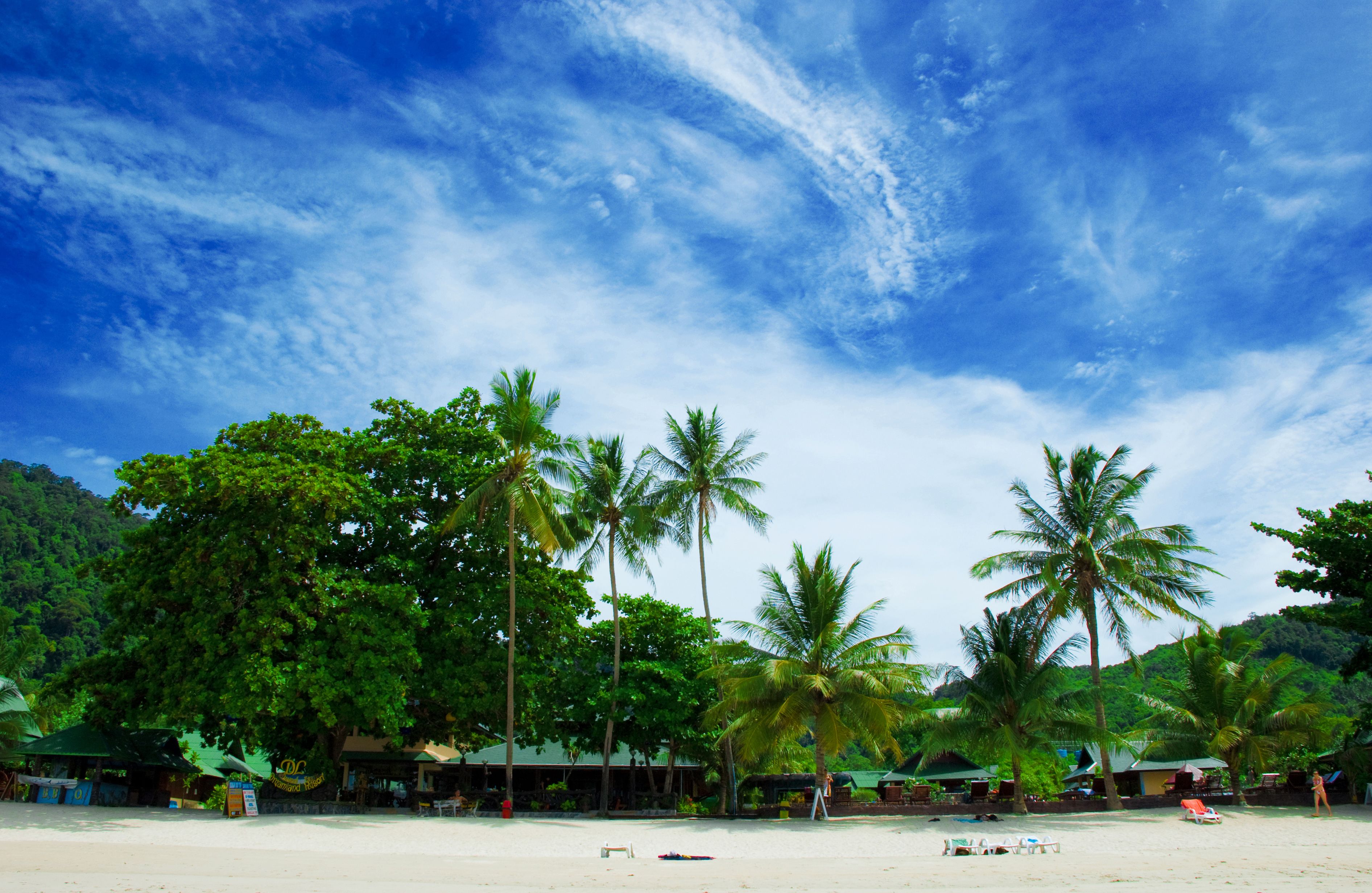 On the beach, sun-loungers, beach umbrellas, scuba diving