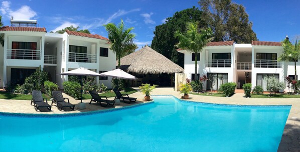 Outdoor pool, pool umbrellas, sun loungers