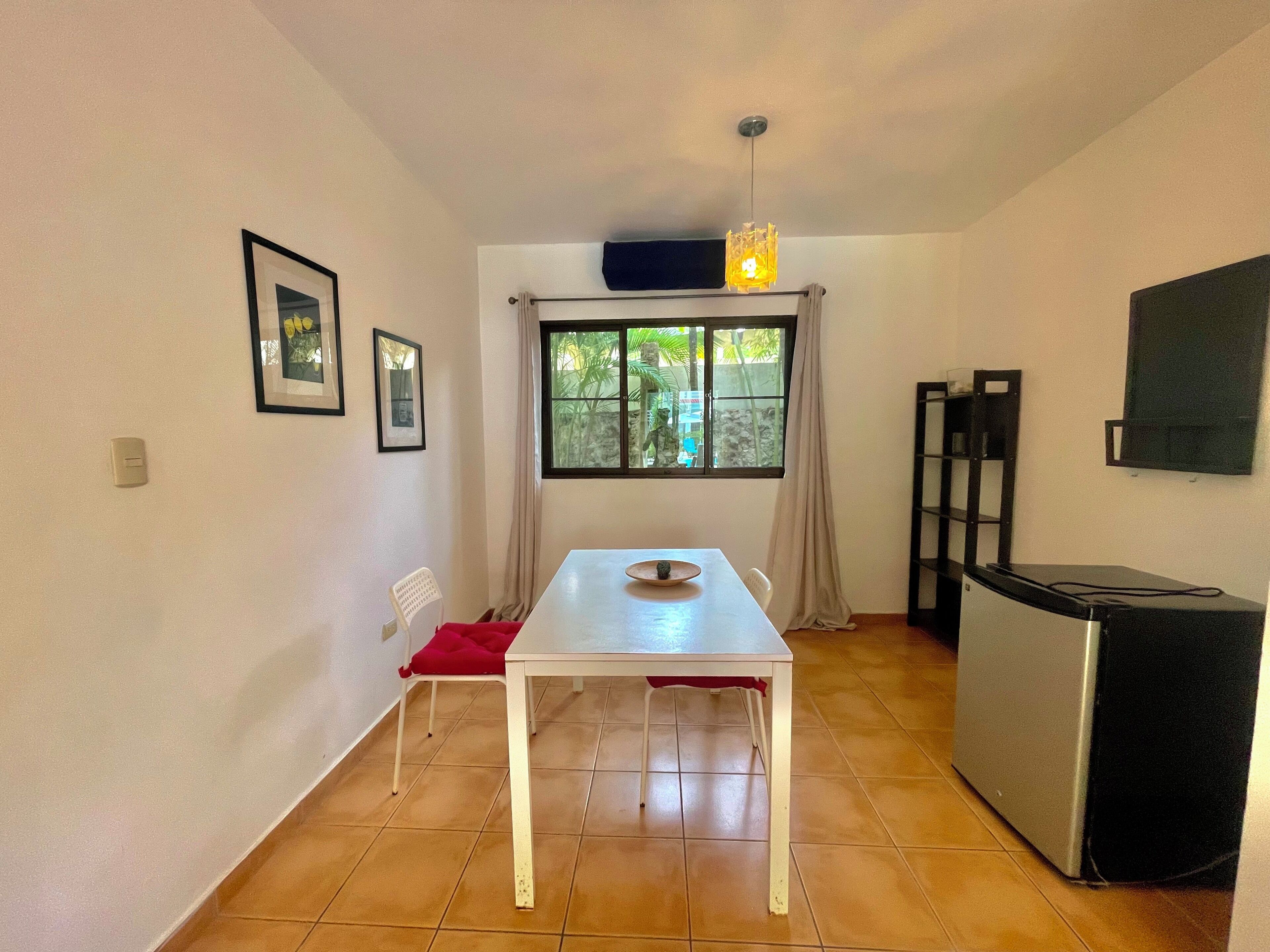 comfort suite, 1 bedroom, balcony, pool view | living area | led tv