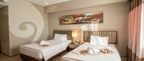 A hotel room with two beds, a painting on the wall, a nightstand, and a curtain.