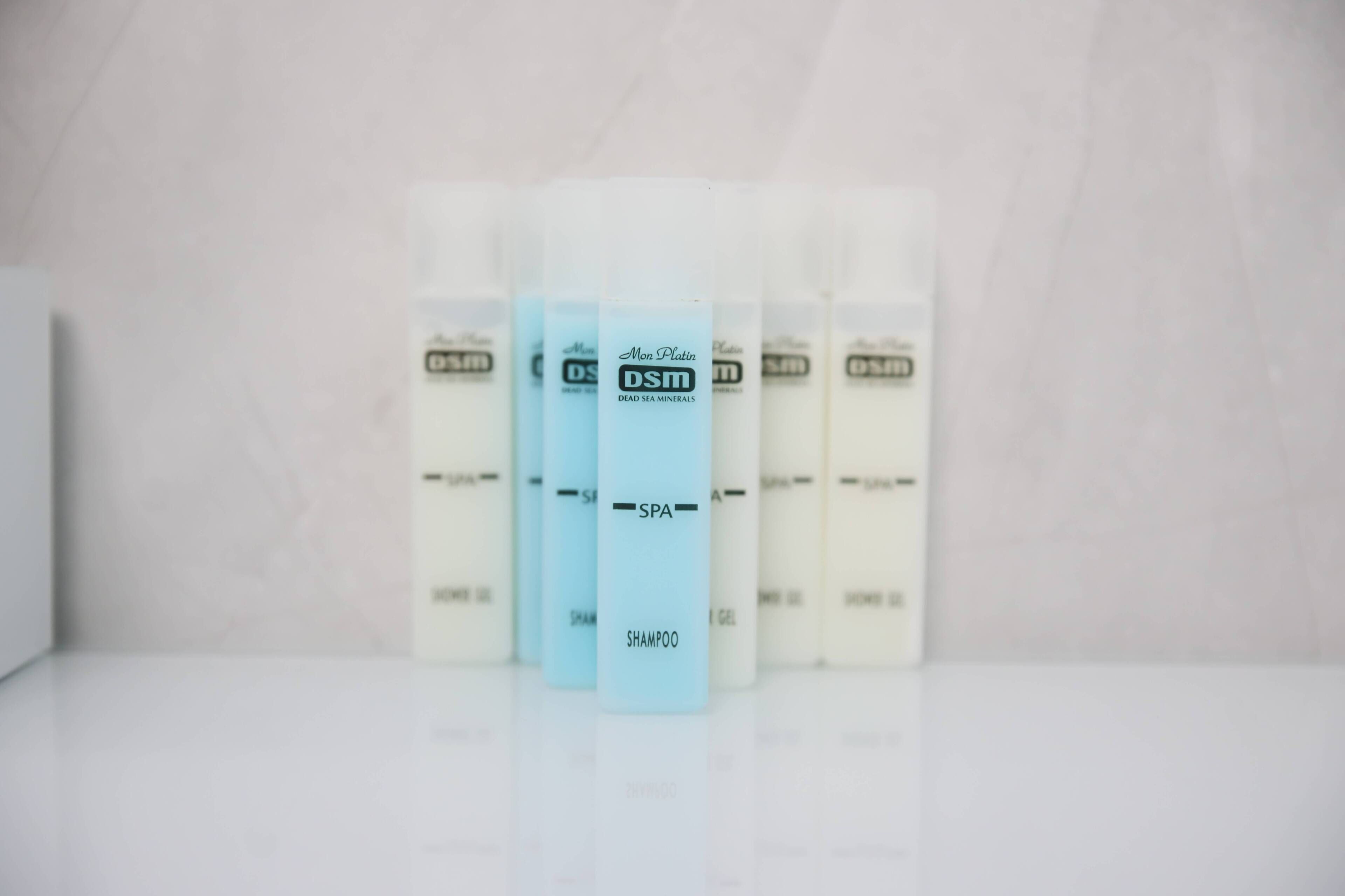 rainfall showerhead, hair dryer, slippers, towels