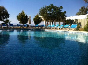 Outdoor pool, pool umbrellas, sun loungers