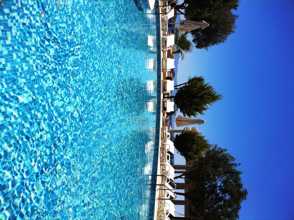 Outdoor pool, pool umbrellas, sun loungers