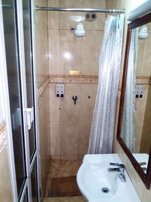 Shower, free toiletries, slippers, towels