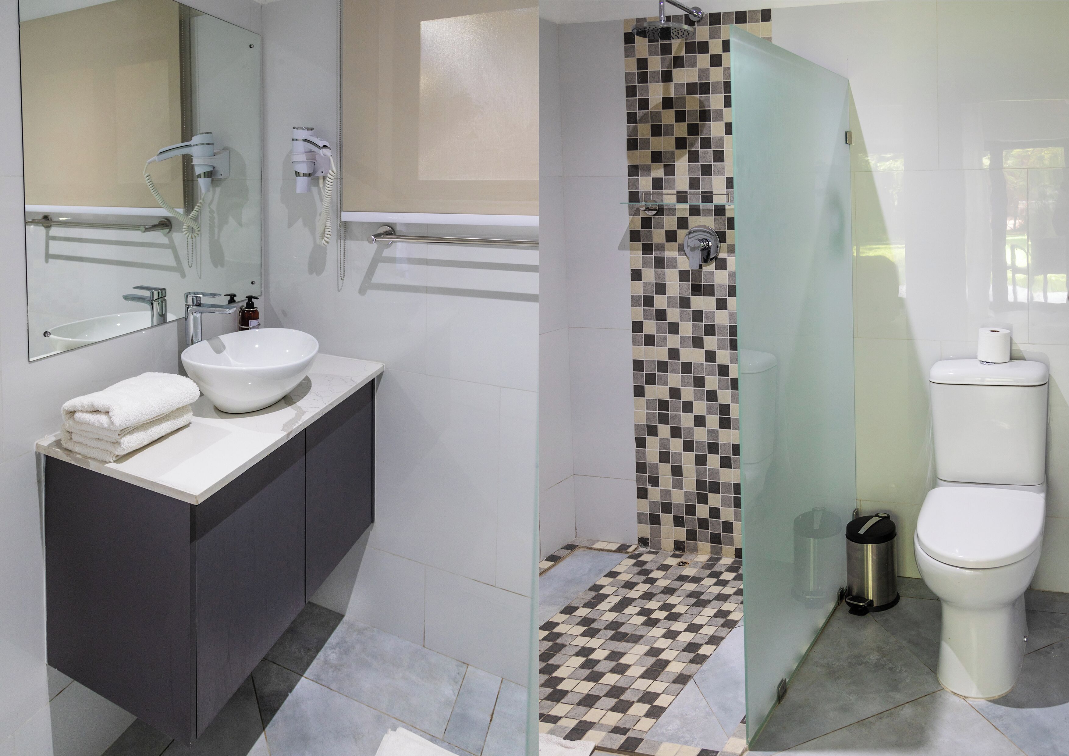 A modern bathroom with a vanity, sink, and mirror.