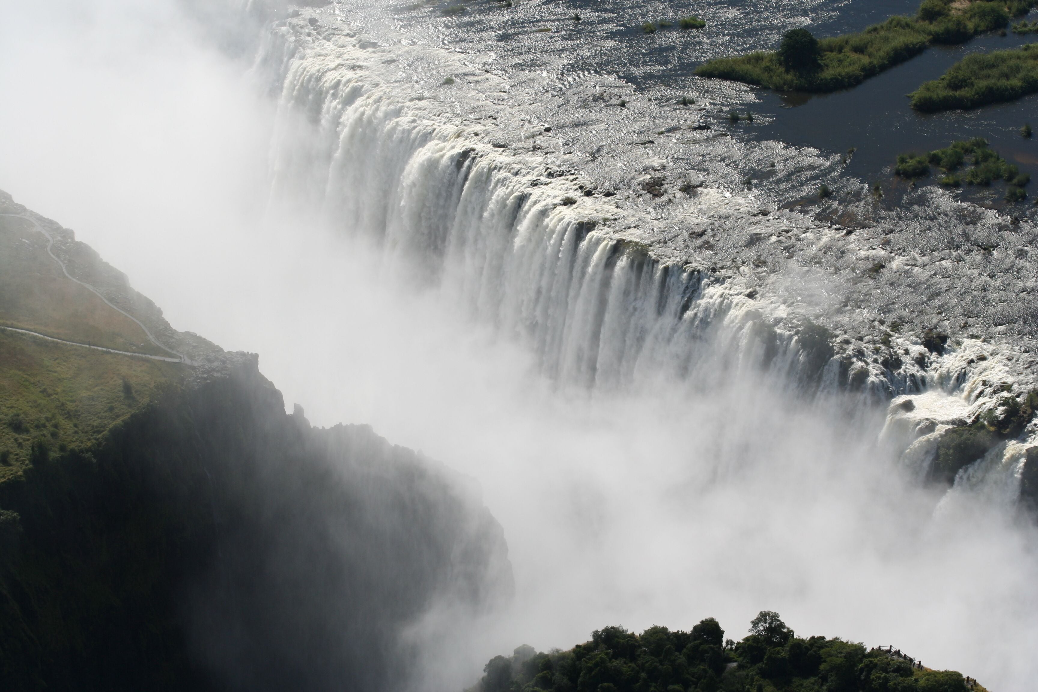 A large waterfall cascading down a rocky cliff.