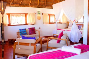 Family Quadruple Room, Multiple Beds, Partial Sea View | In-room safe, individually decorated, individually furnished