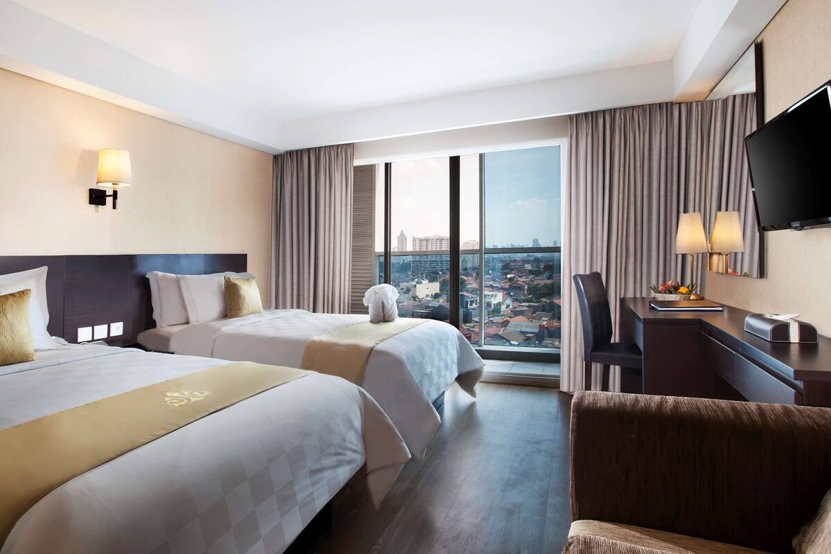 1 kamar tidur, seprai premium, minibar, dan brankas