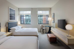 A hotel room with two beds, a desk with a chair, a TV, and a window with a city view. - Hyatt Centric The Loop Chicago (Chicago)