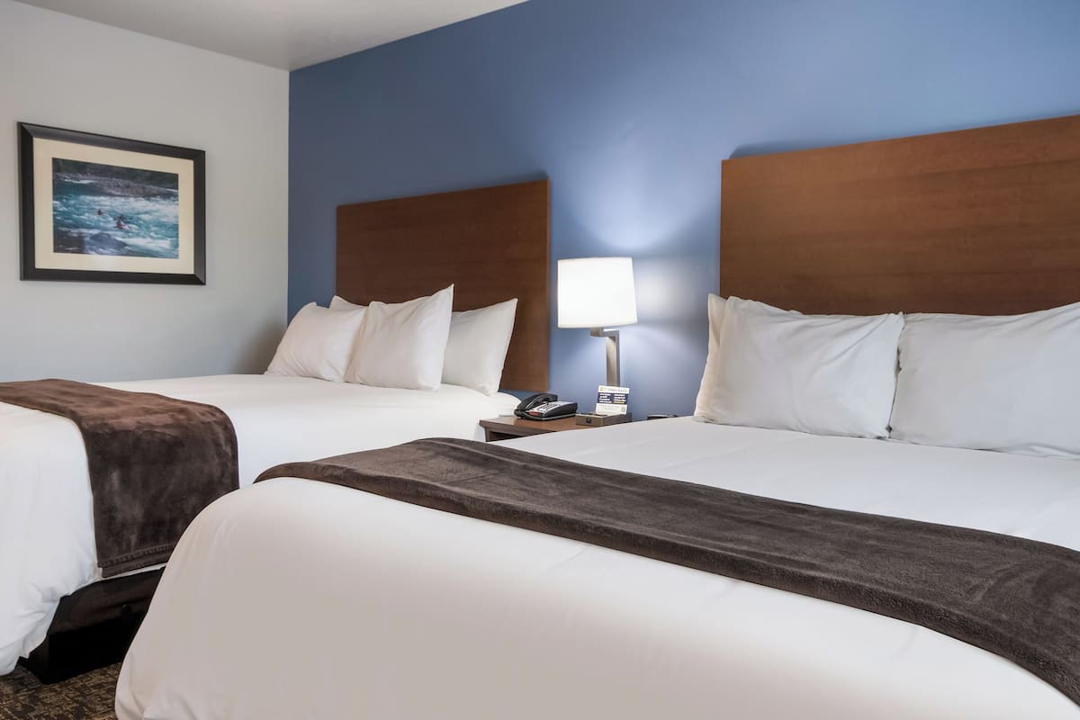 premium bedding, pillow-top beds, desk, laptop workspace