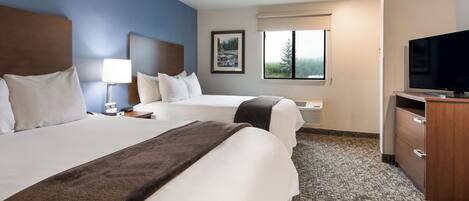 Premium bedding, pillow-top beds, desk, laptop workspace