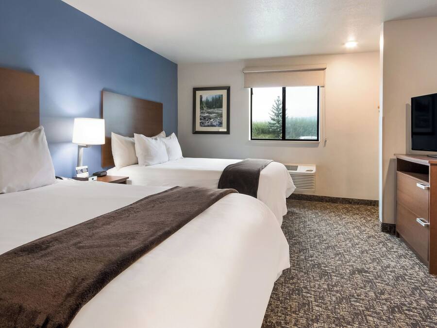 Premium bedding, pillow-top beds, desk, laptop workspace