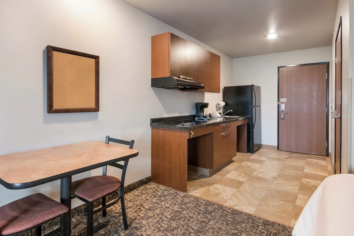 full-sized fridge, microwave, stovetop, coffee/tea maker