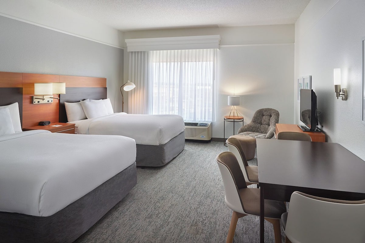 Studio, 2 Queen Beds | In-room safe, iron/ironing board, free cribs/infant beds, free WiFi