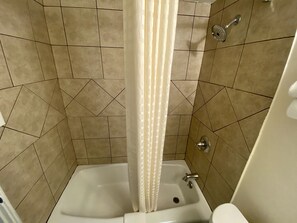 Standard Room, 1 Double Pillow top Bed | Bathroom | Combined shower/tub, hair dryer, towels