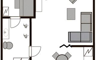Plano de planta que muestra una cocina, comedor y dos dormitorios.