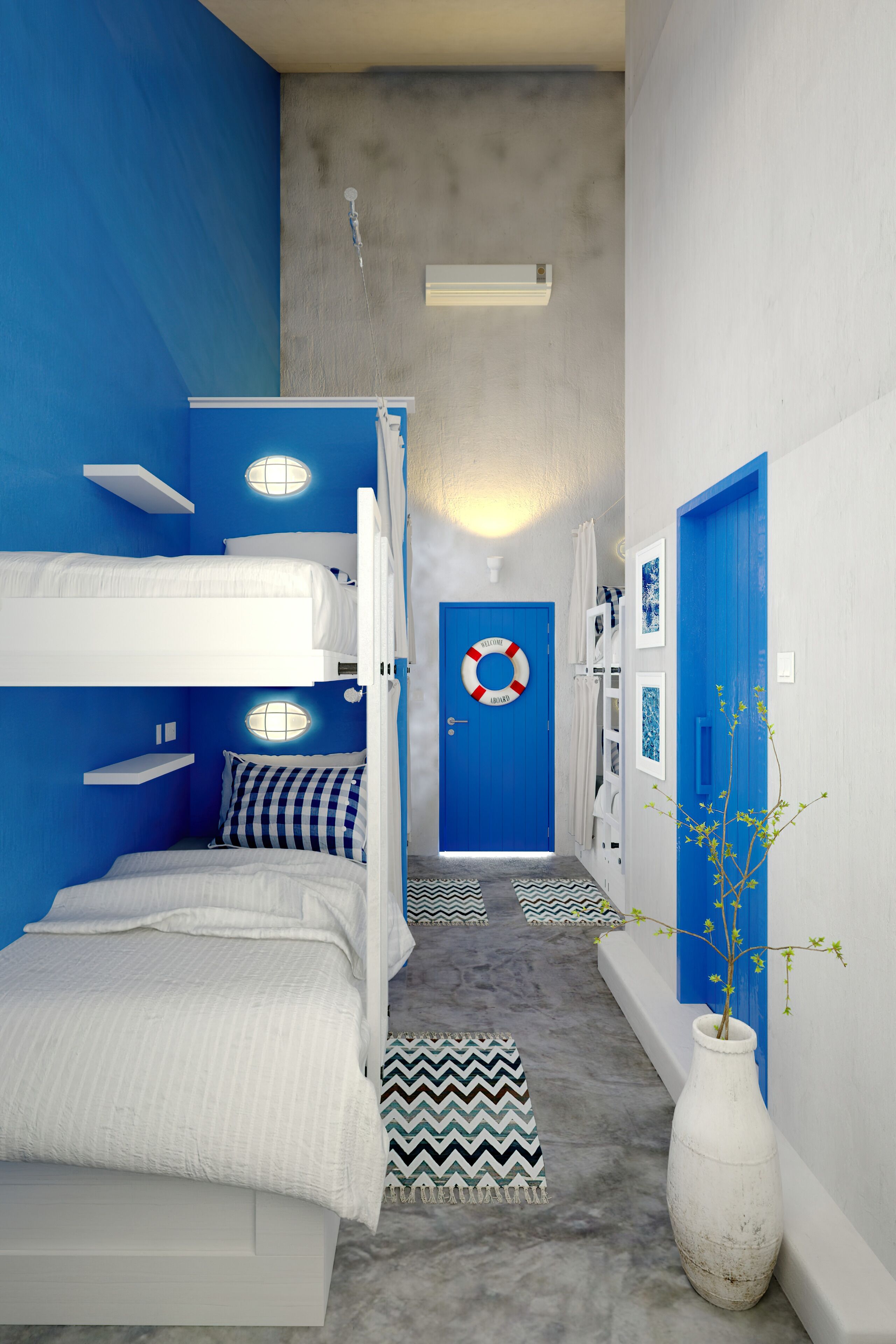 A room with bunk beds, a blue door, and a life preserver decoration.