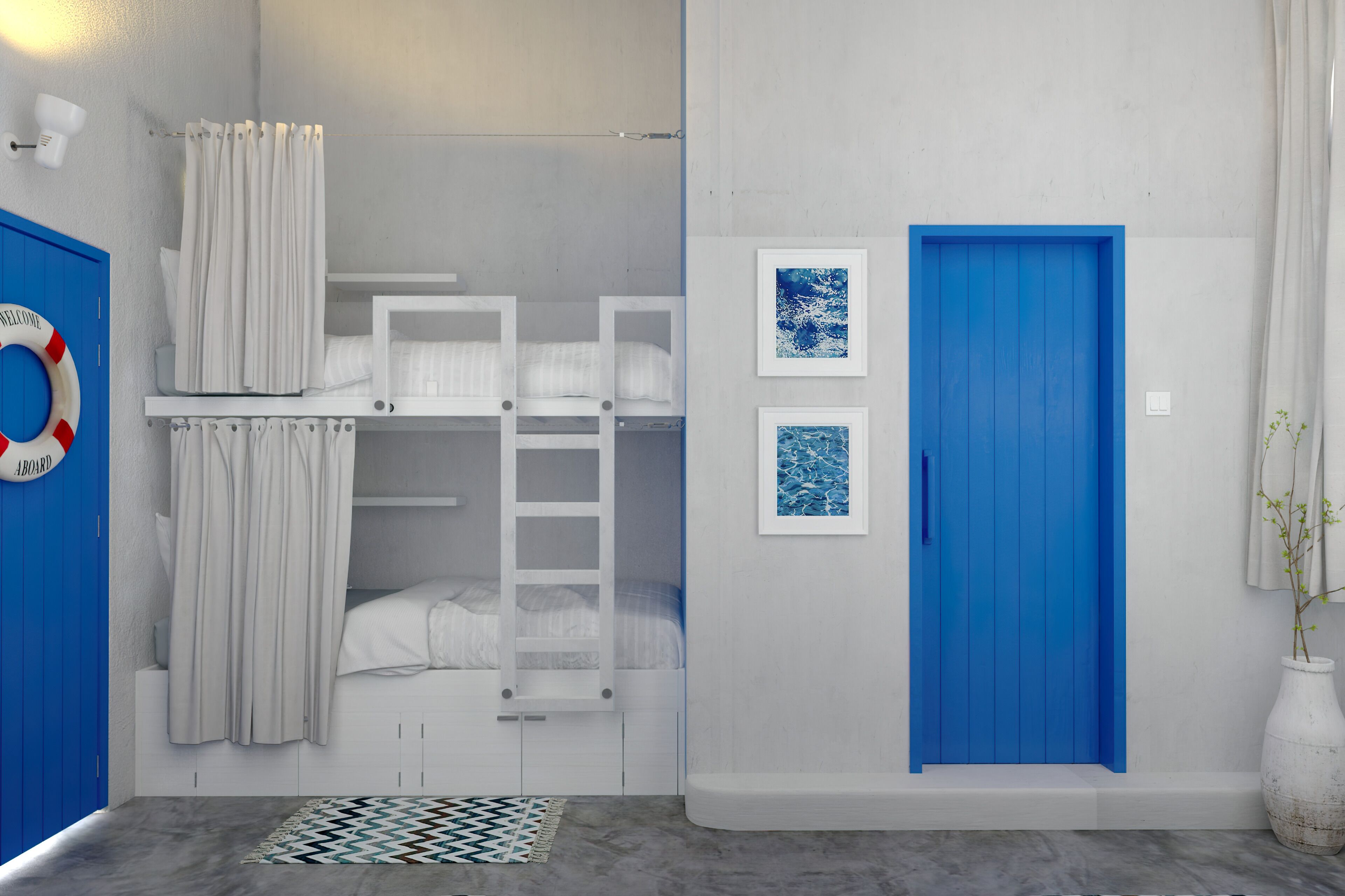 A room with bunk beds, a blue door, and two framed pictures on the wall.